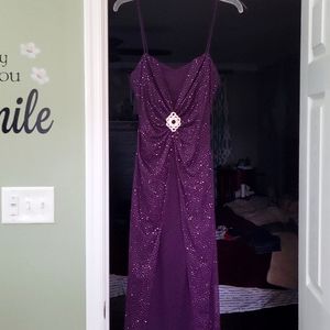 Gorgeous purple spaghetti strap gown with beautiful sparkling sequins.